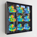 Holographic duck pop art – 3D resin wall decor in black metal frame, 20cm x 20cm, hanging on wall