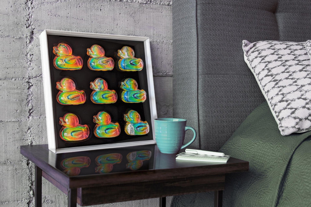 Detail of holographic duck pop art wall piece – colorful 3D resin duck in metal frame