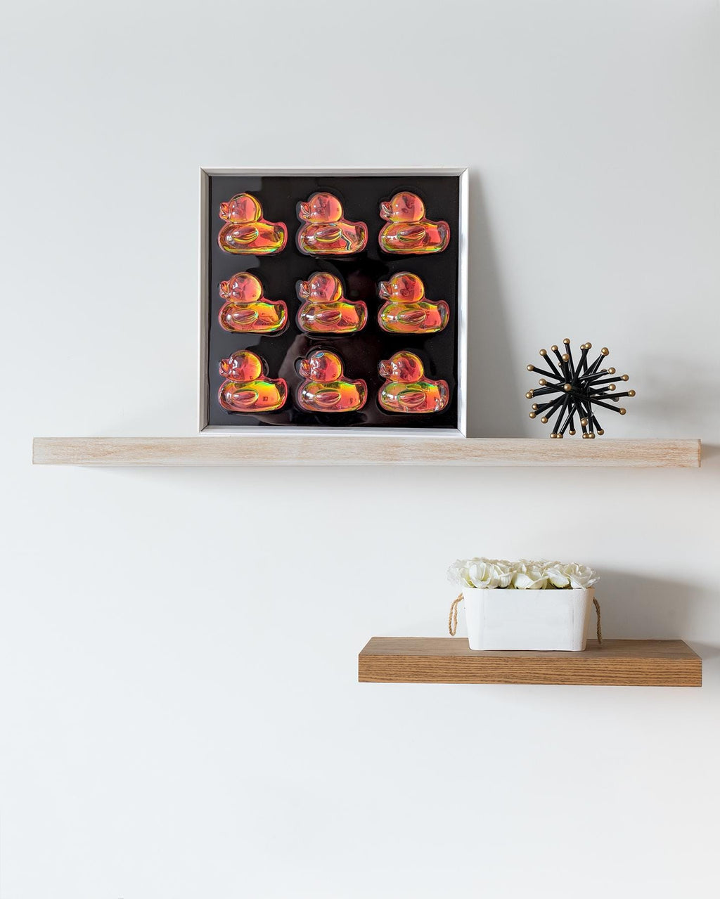 Arrangement of holographic duck pop art frames on wall – unique conversation starter wall art